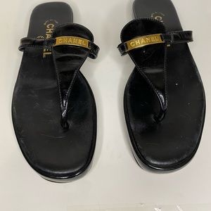 Chanel black sandals.